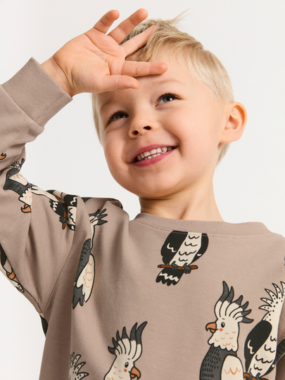 Extra lång sweatshirt med kakaduor