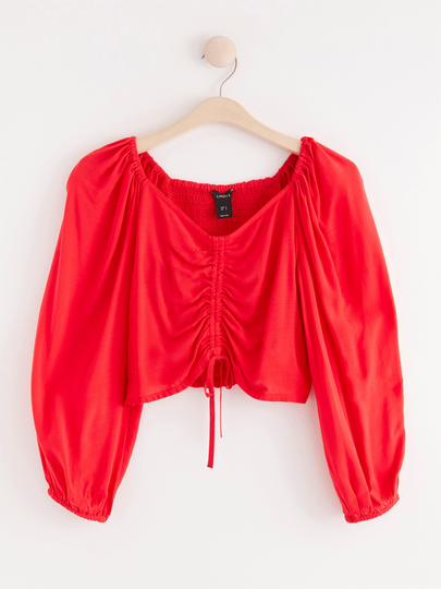 Blus med dragsko
